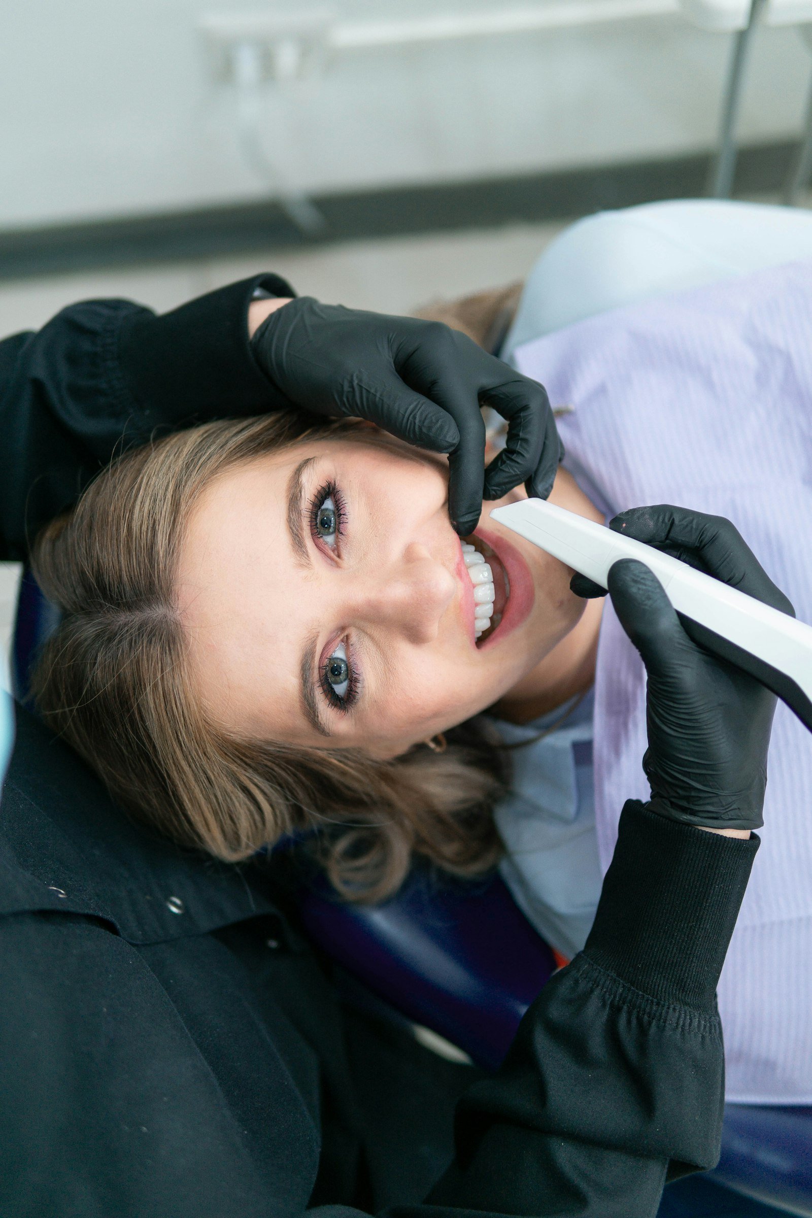 A patient being fitted with a clear aligner